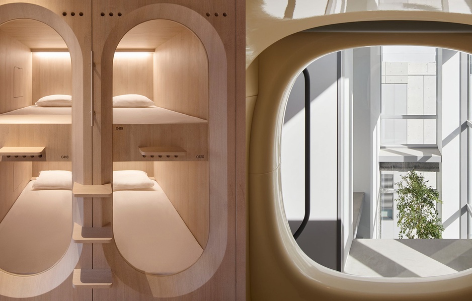 Stacked wooden sleeping capsules with oval openings